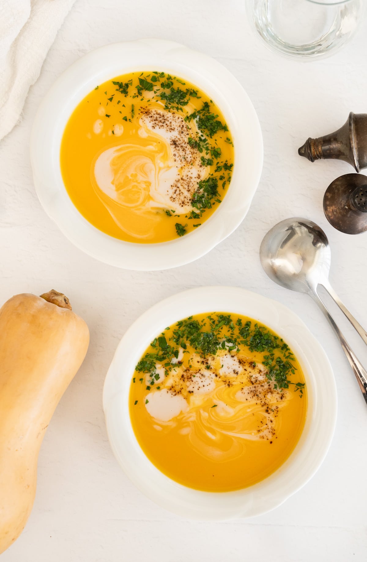two bowls of butternut squash soup 