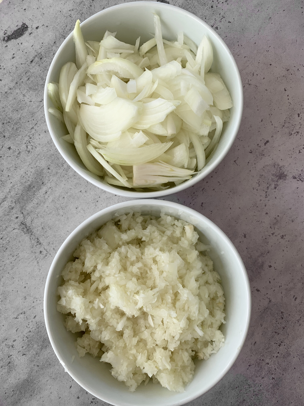 one bowl of sliced onion and one bowl of minced onion