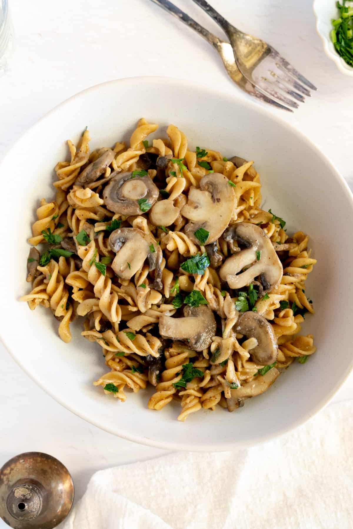 spiral pasta with mushrooms and chopped parsley