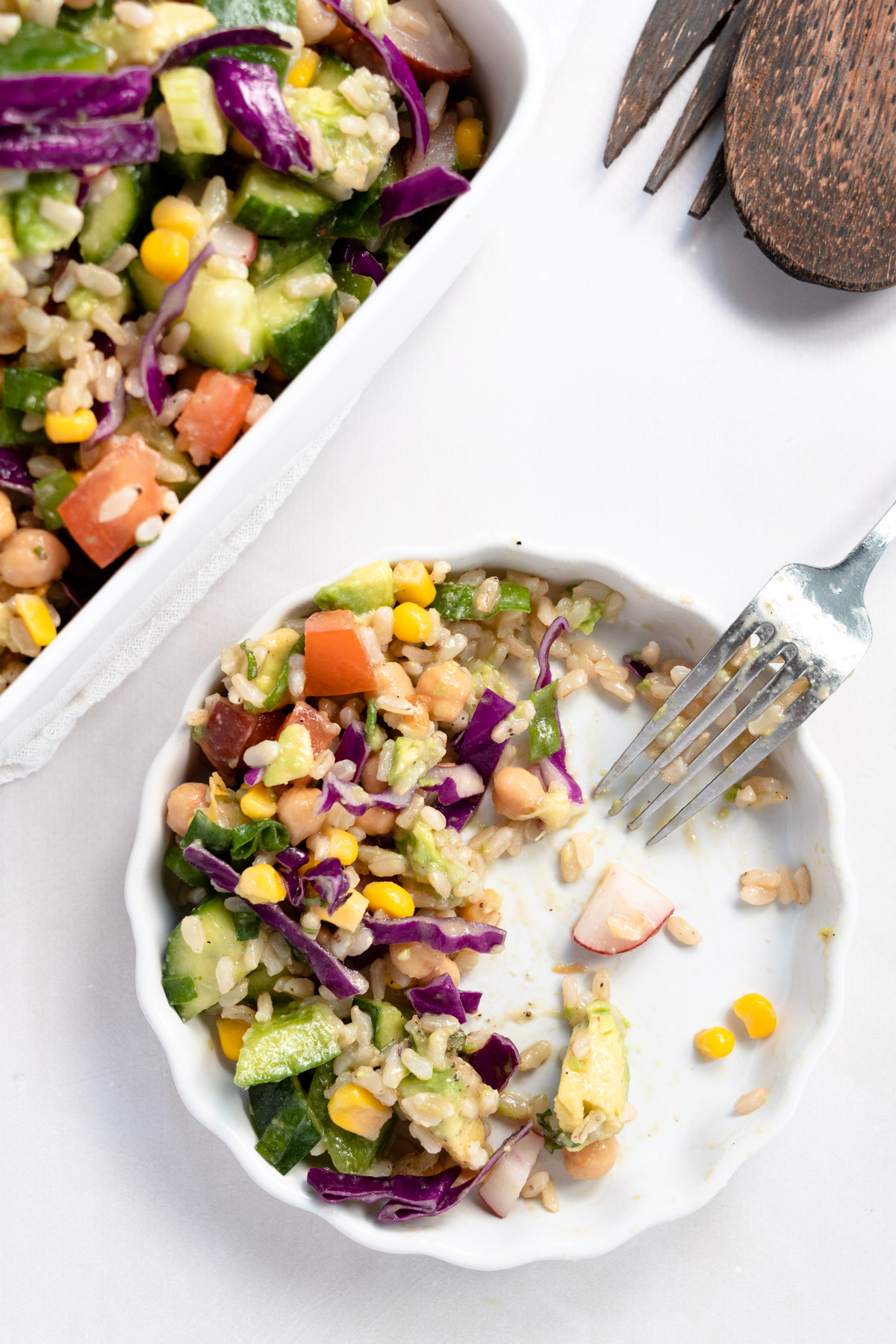 round white plate with brown rice salad