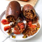 two eggplants stuffed with rice, vegetable with tomato sauce