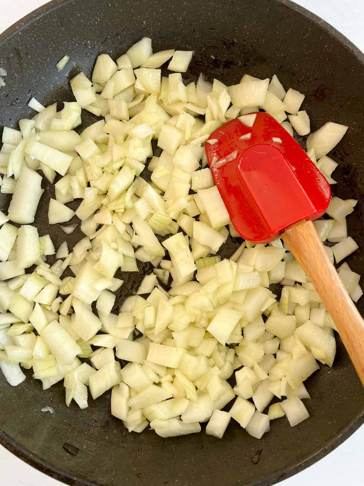 sweating onions in a fry pan