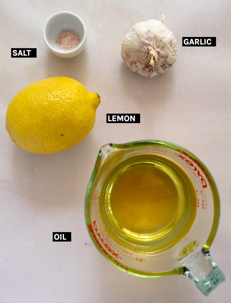 oil, lemon, salt and garlic laid out