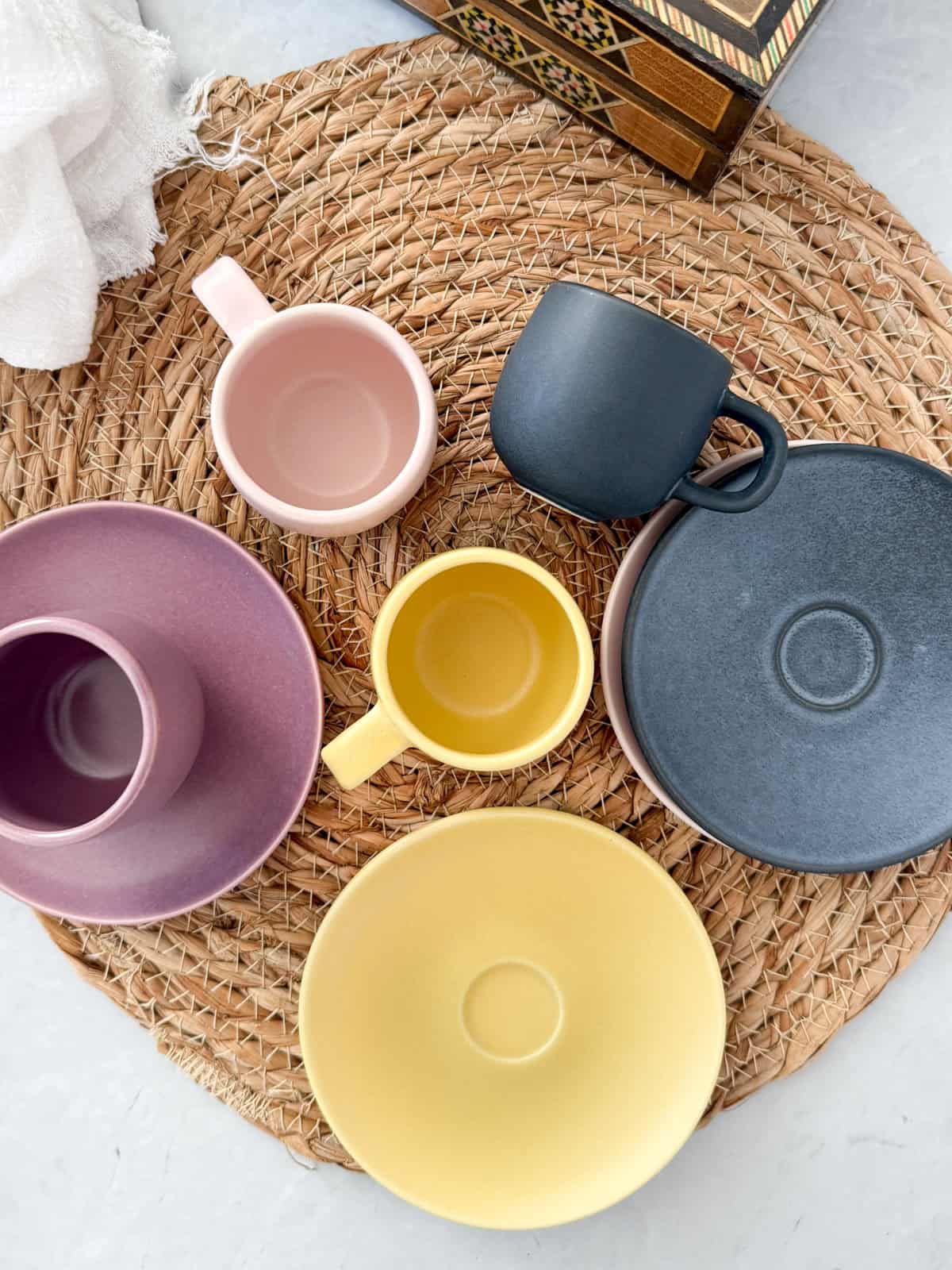 three demitasse cups and saucers