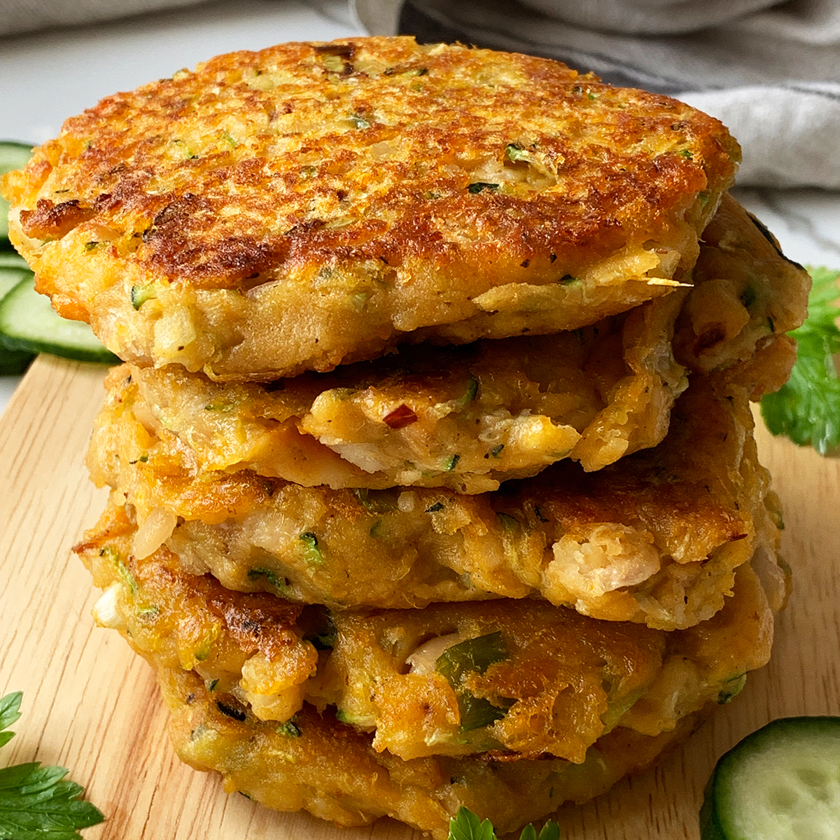 A close up of a stack of sweet potato and zucchini fritters