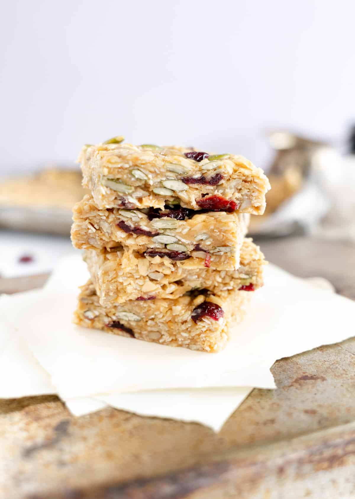 a stack of five muesli bars on white paper