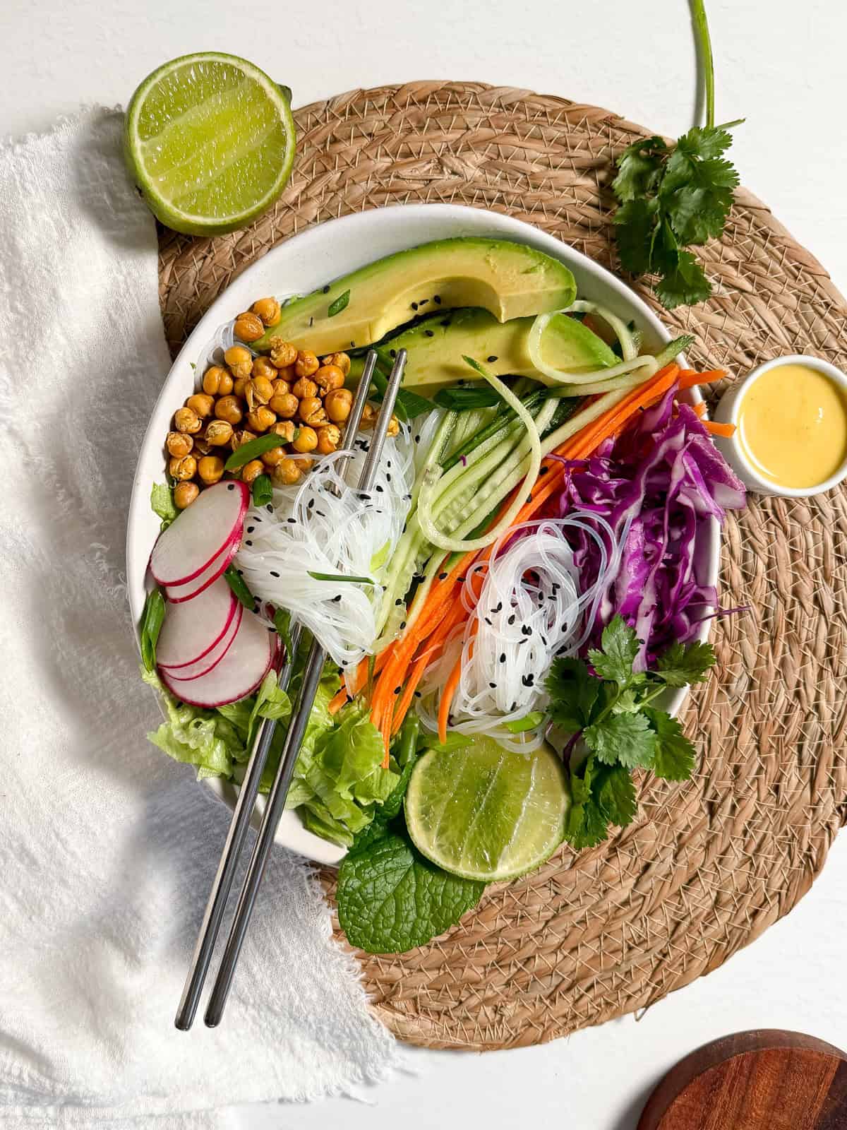 noodles in a bowl with shredded veggies