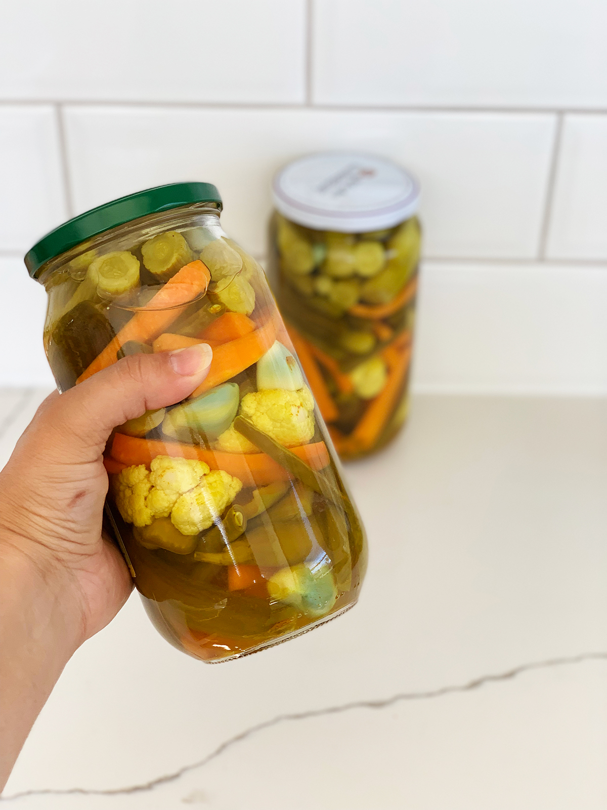 How to make pickled vegetable recipe - Armenian Tourshi in a jar with a hand
