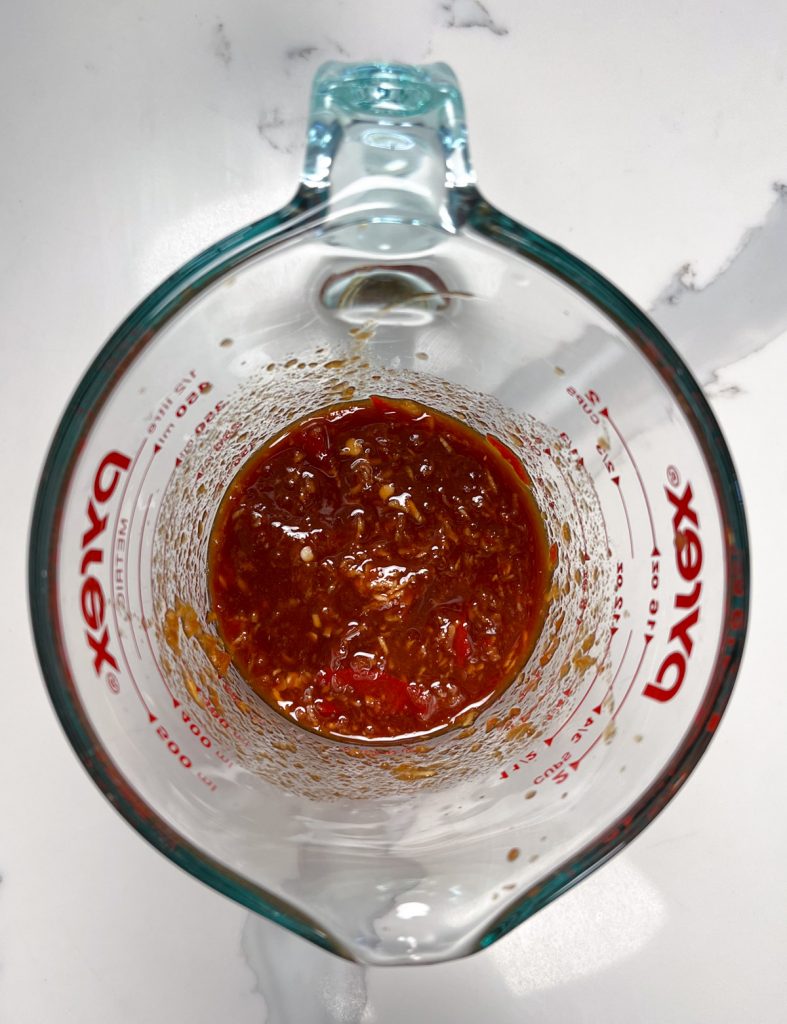 red sauce in a jug