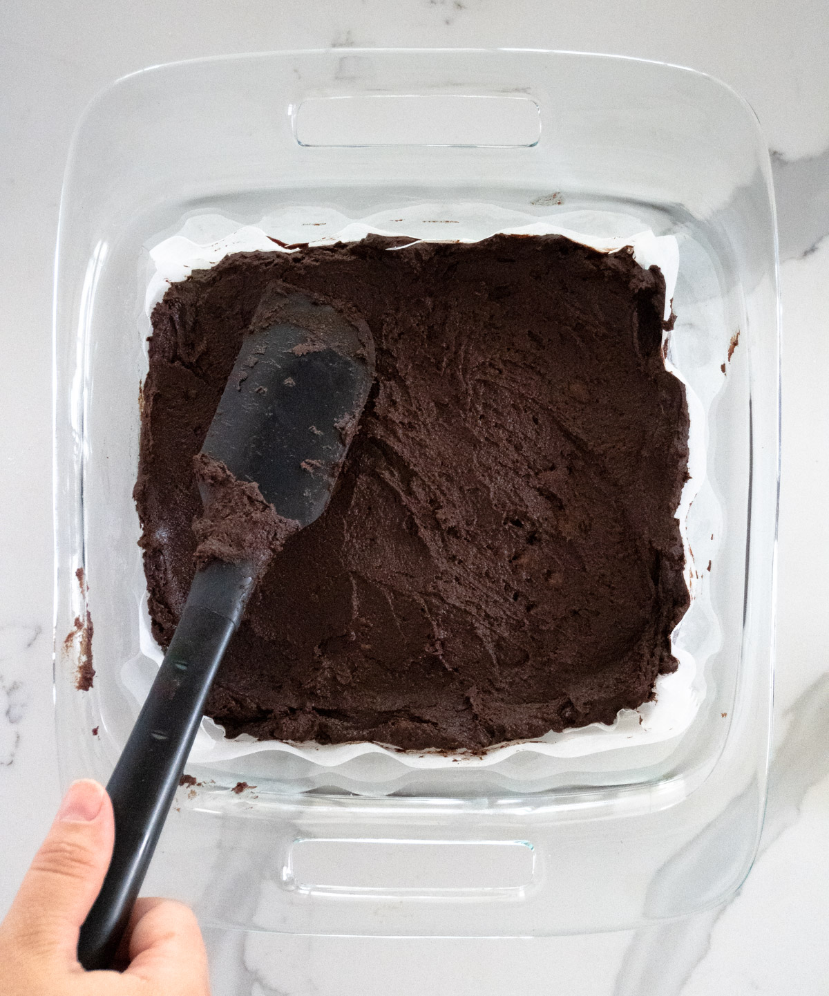 spread the batter with a black spatula into a glass pan