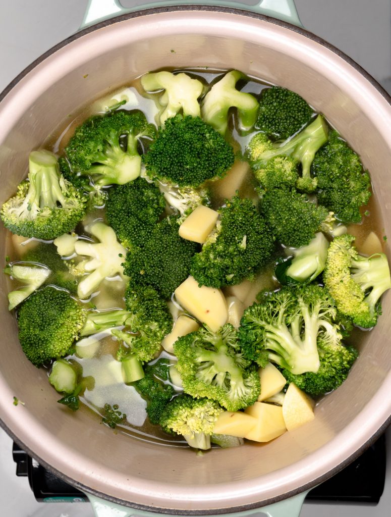 broccoli florets, potato pieces and vegetable stock in a pot