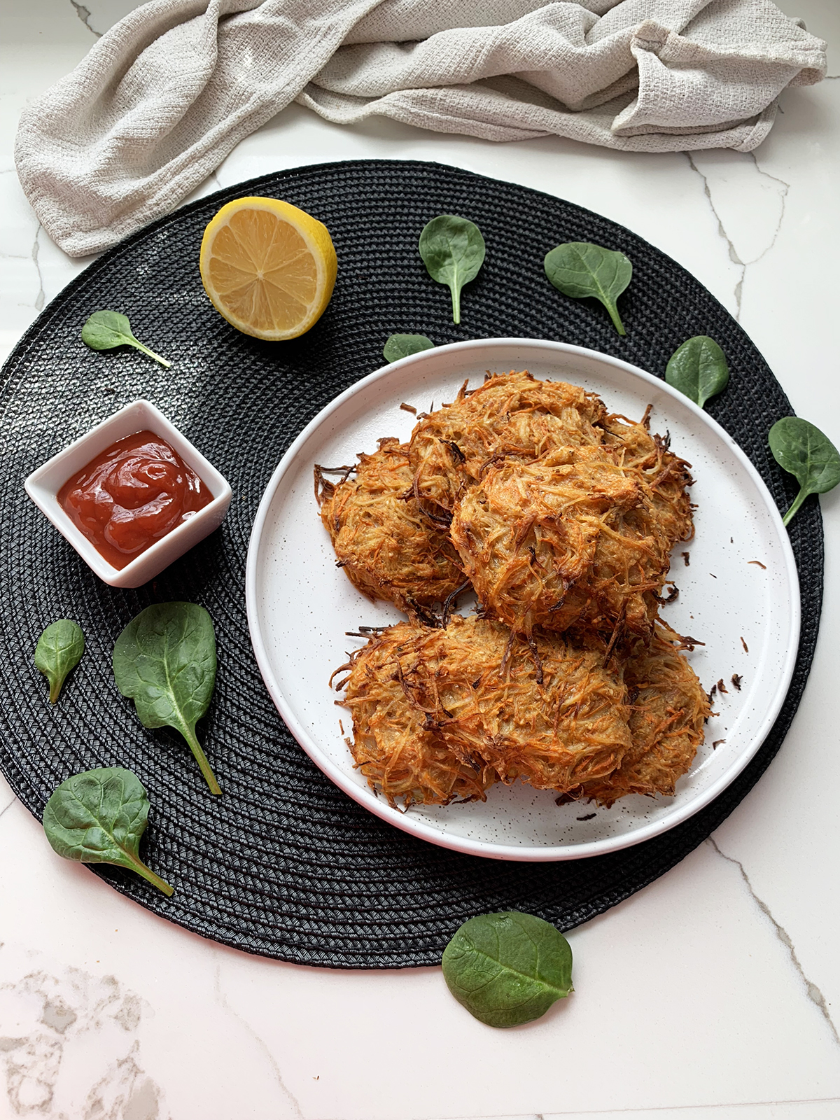 baked vegan hash browns served with tomato sauce