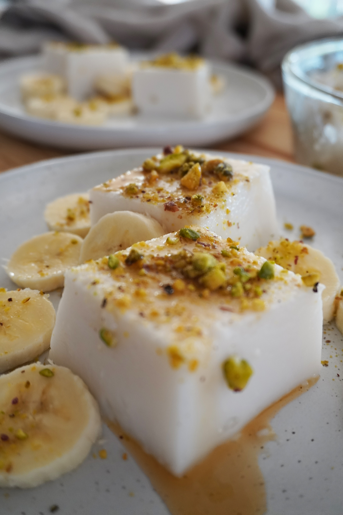 Haytaliyeh served with banana slices and a drizzle of maple syrup
