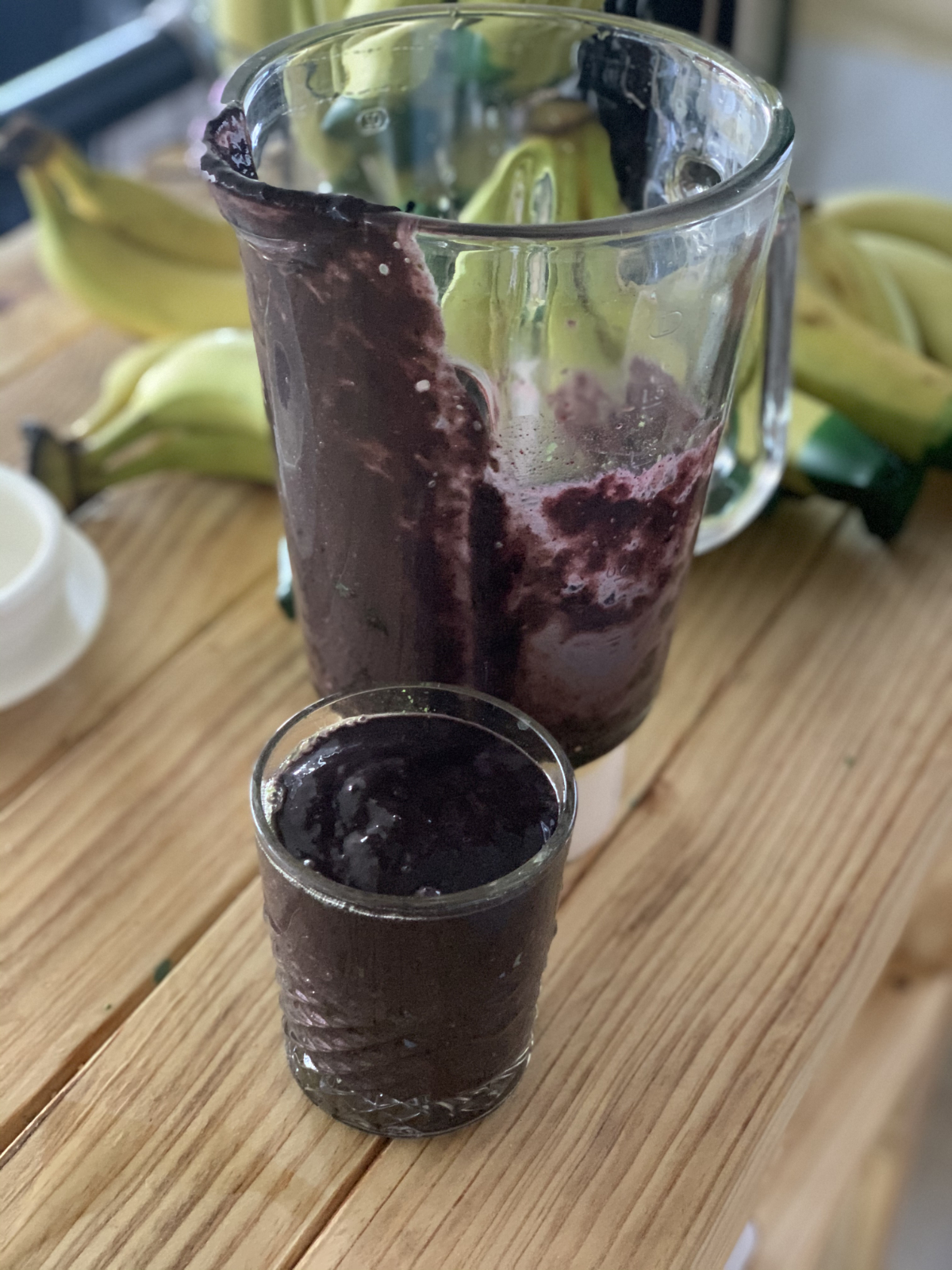 dark purple smoothie in a short glass