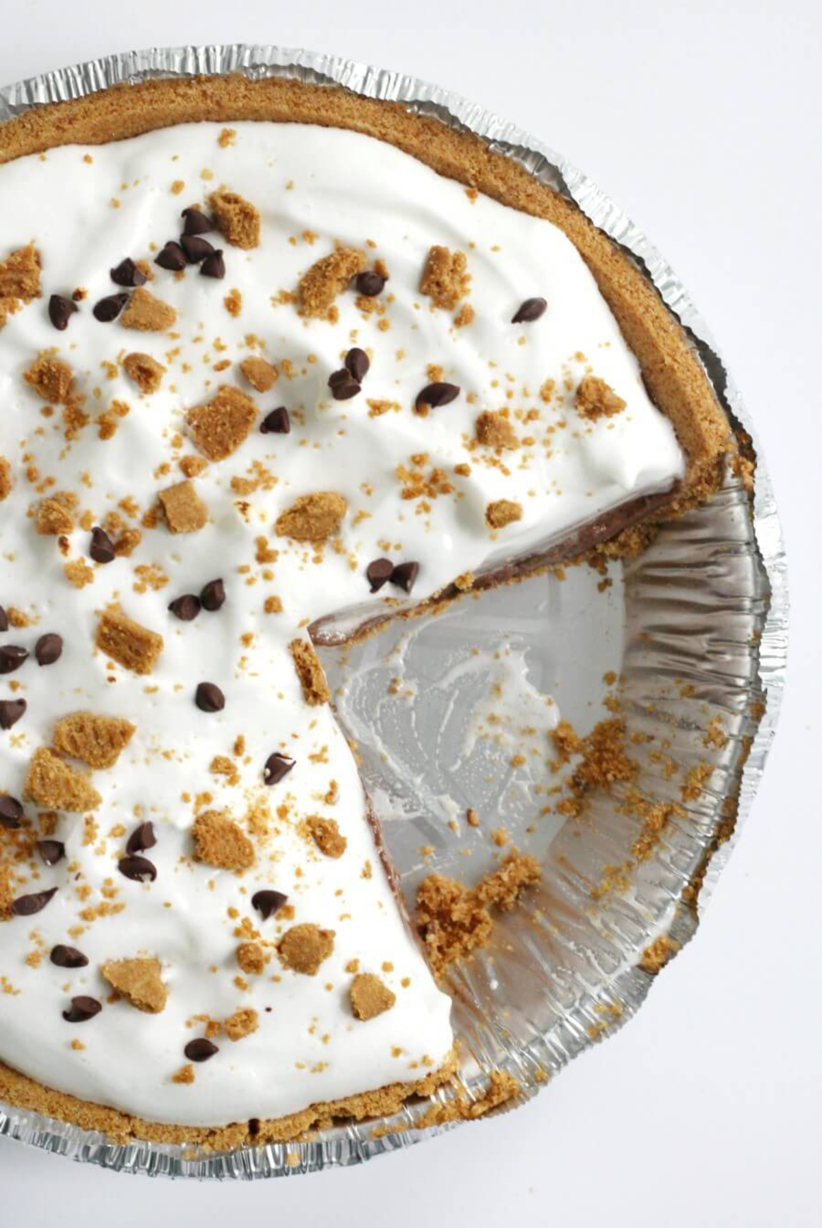smores pie in a pie tray with a slice missing