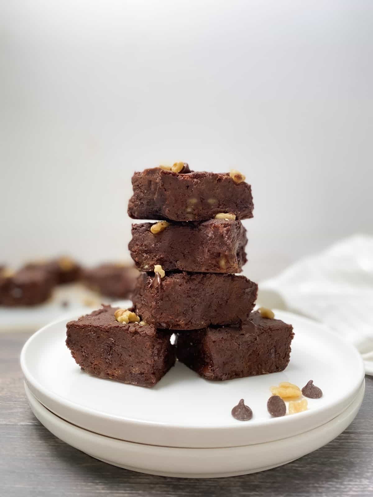 stack chickpea brownies in two plates