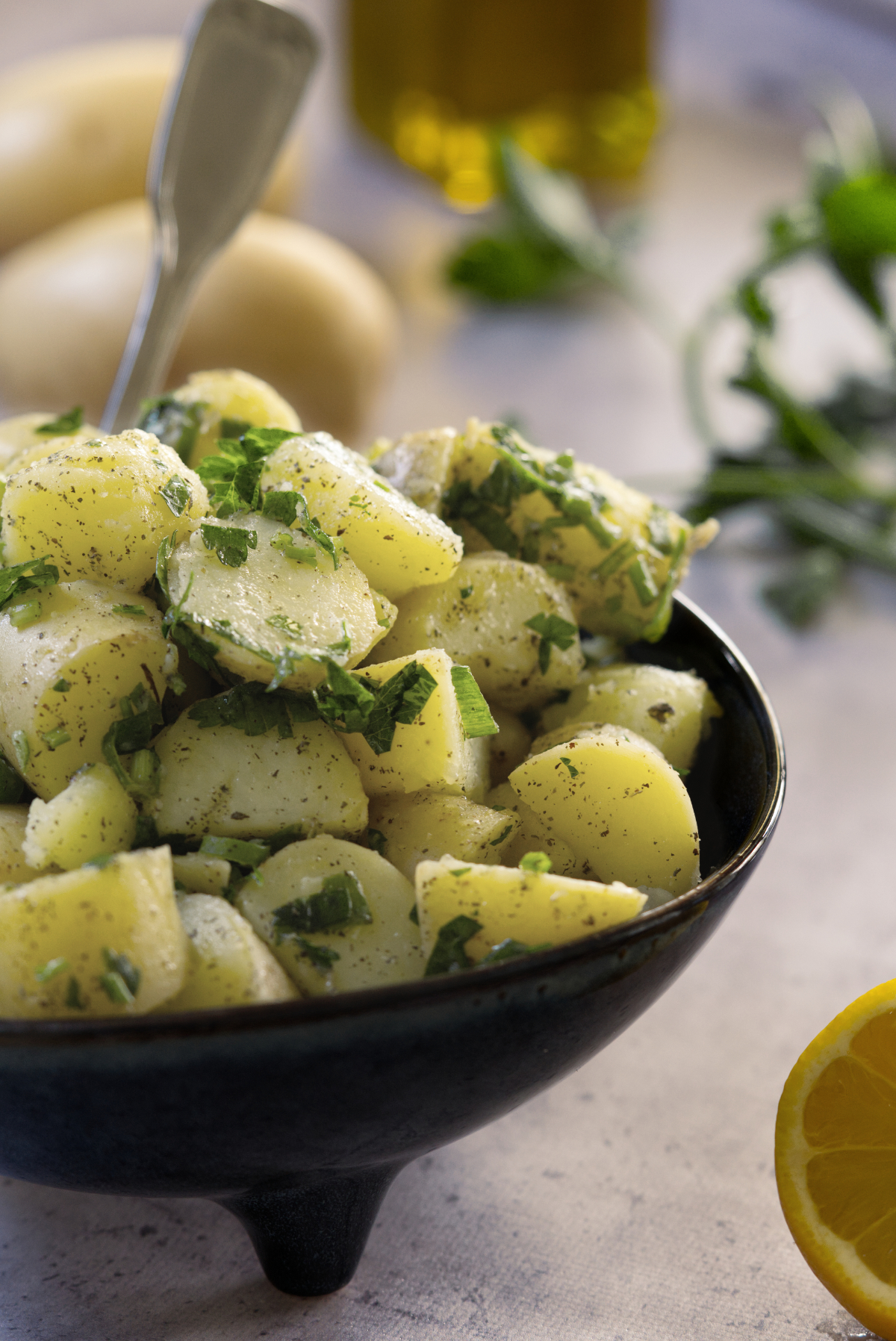 Lebanese potato salad (salata batata) in a blue bowl