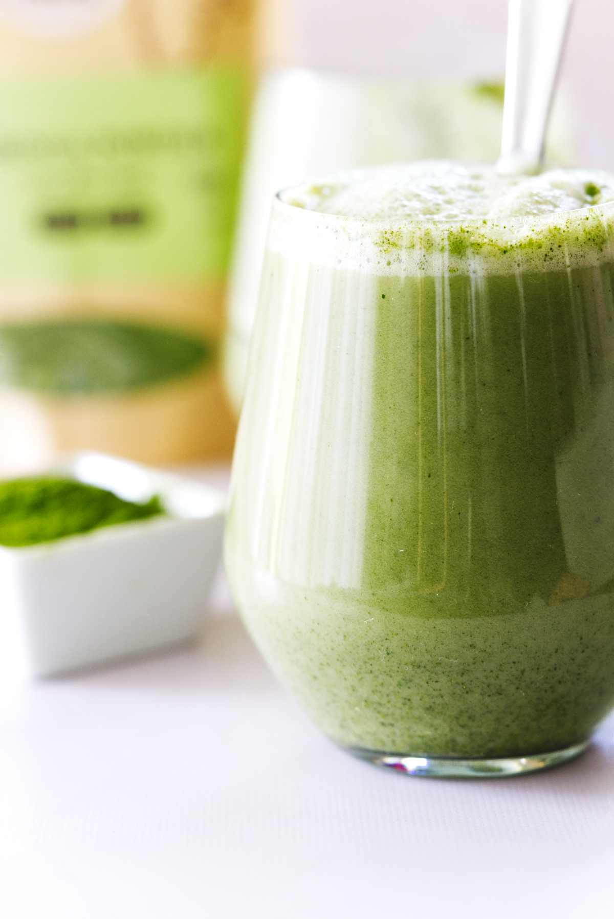 Moringa latte with powder in the background