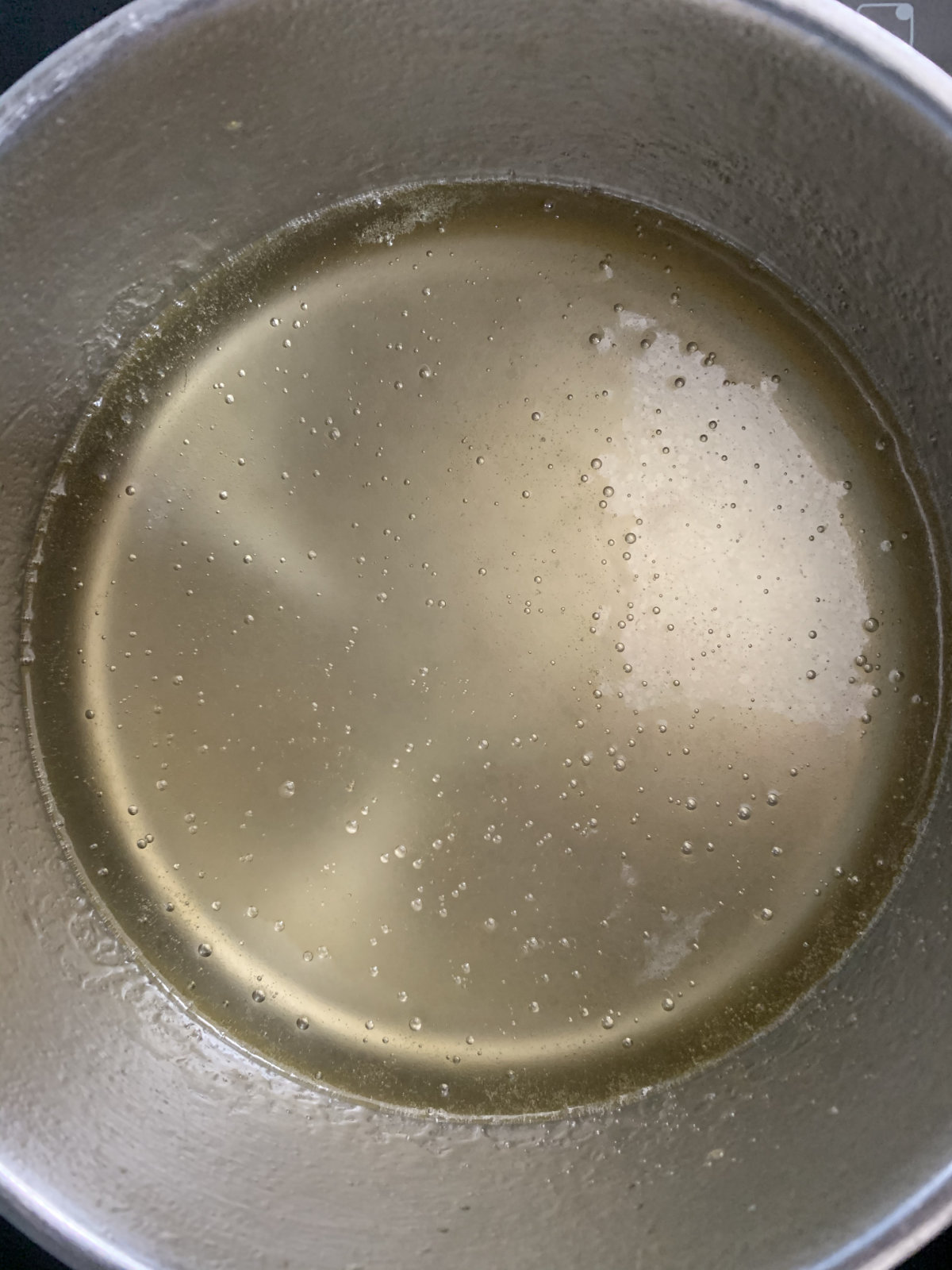 simple syrup with butter through it in a pot