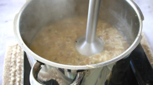 Immersion blender in lentil porridge