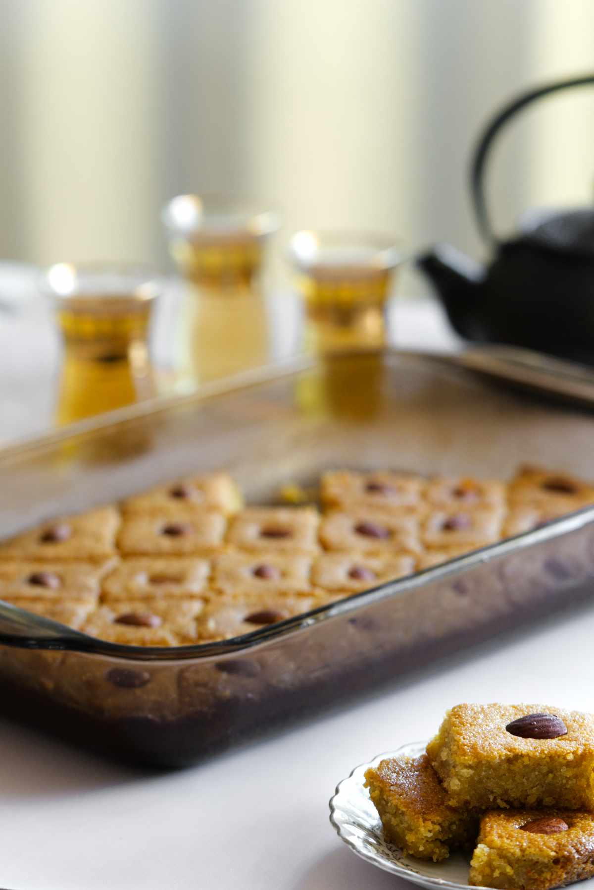 a glass tray with namoura cake in it