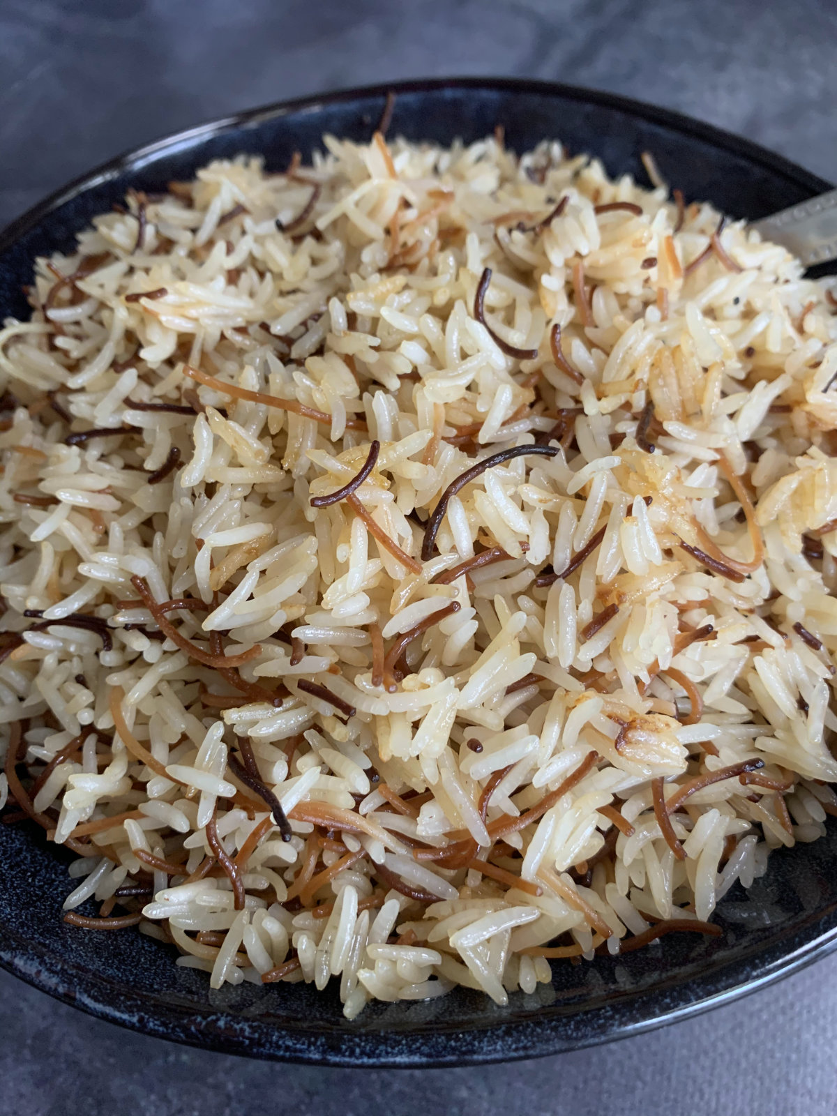 a close up of vermicelli rice in a bowl