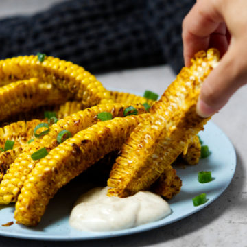 Air fryer corn ribs dipped in mayonnaise