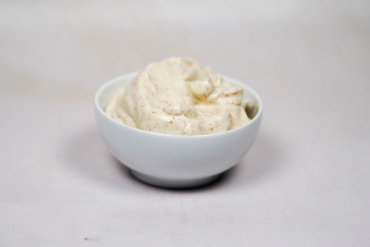 whiteish mayonnaise in a white bowl