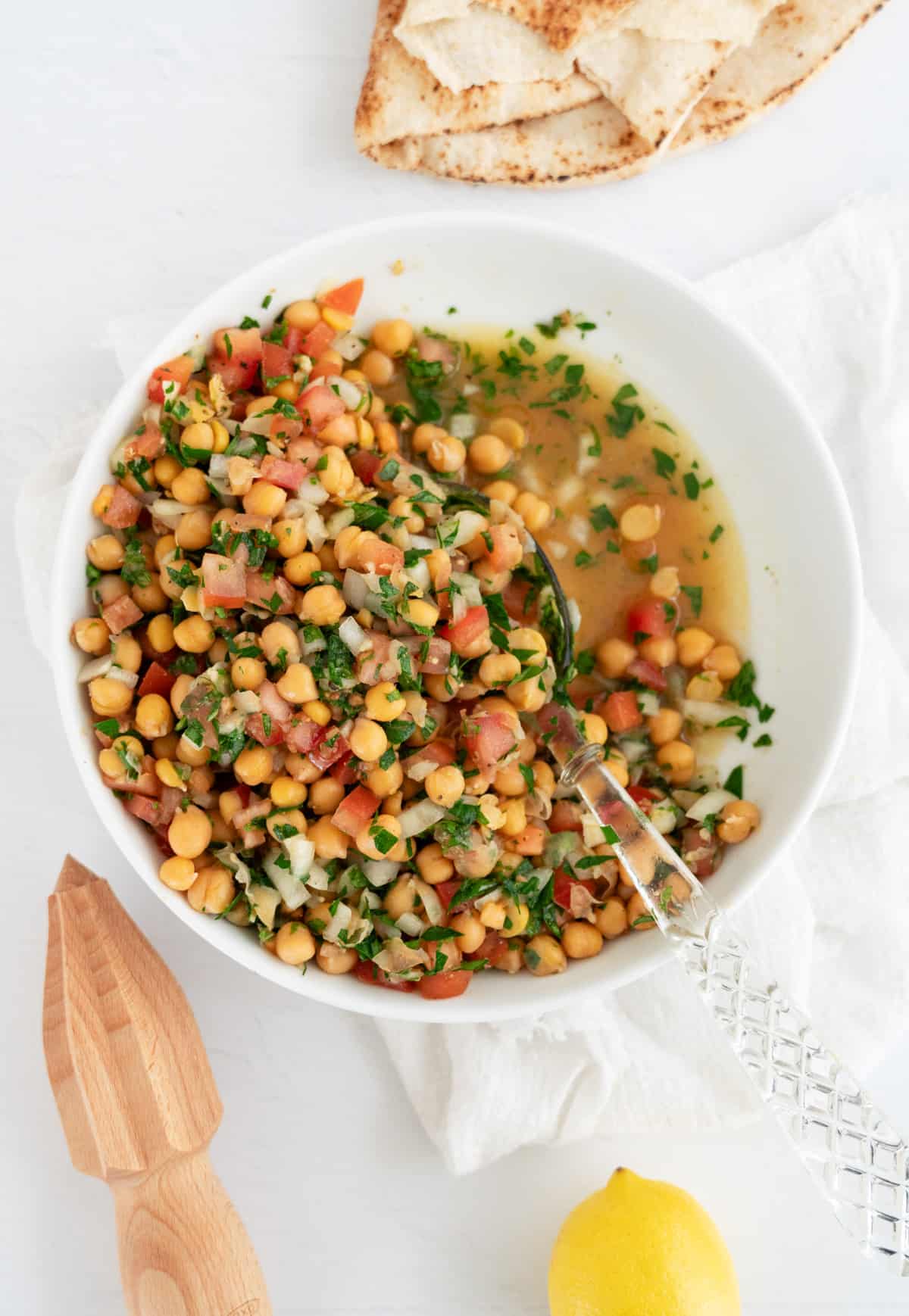 a white bowl of Middle Eastern chickpea salad