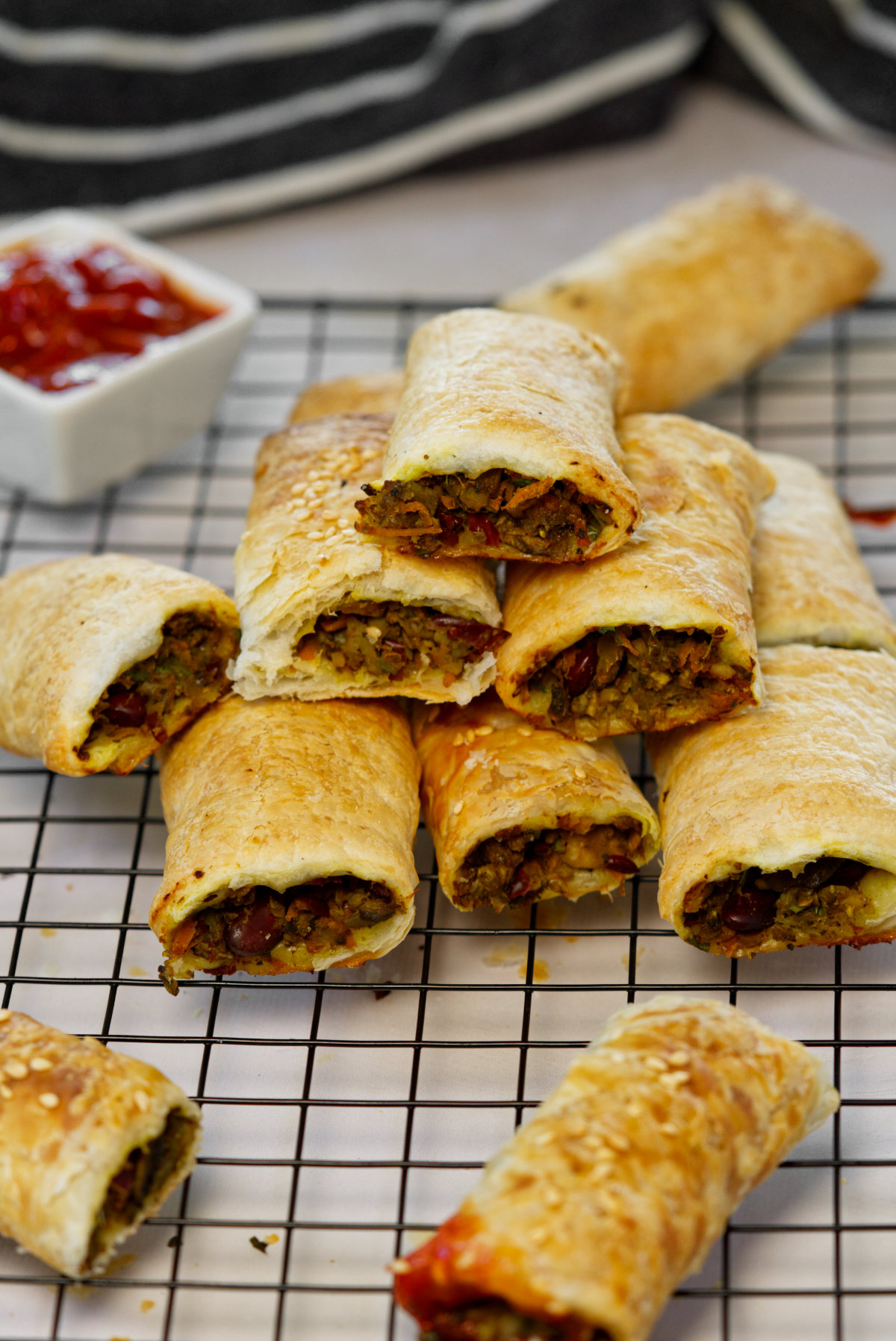 vegan sausage rolls stacked on top of each other