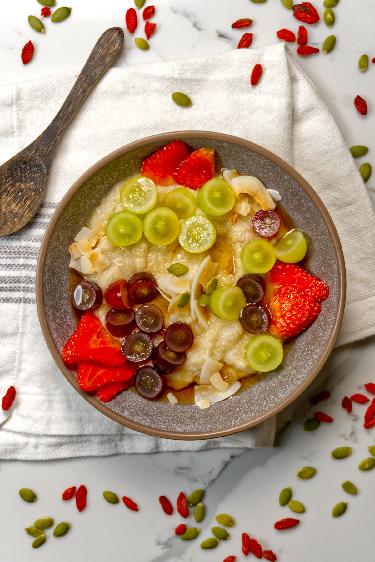 quinoa porridge in a bowl with fresh fruit