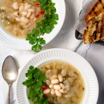 white bean soup in two white bowls