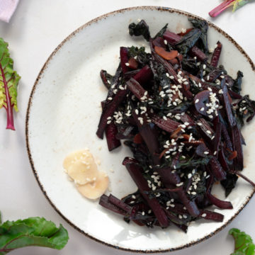 sauteed beetroot leaves in a white plate
