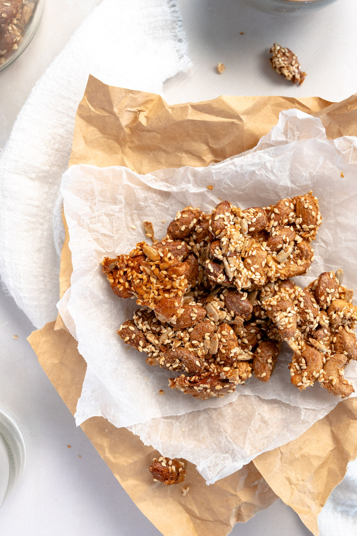 vegan crunchy nuts clusters on white and brown paper