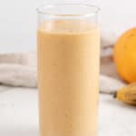 a cup of mango pineapple banana smoothie