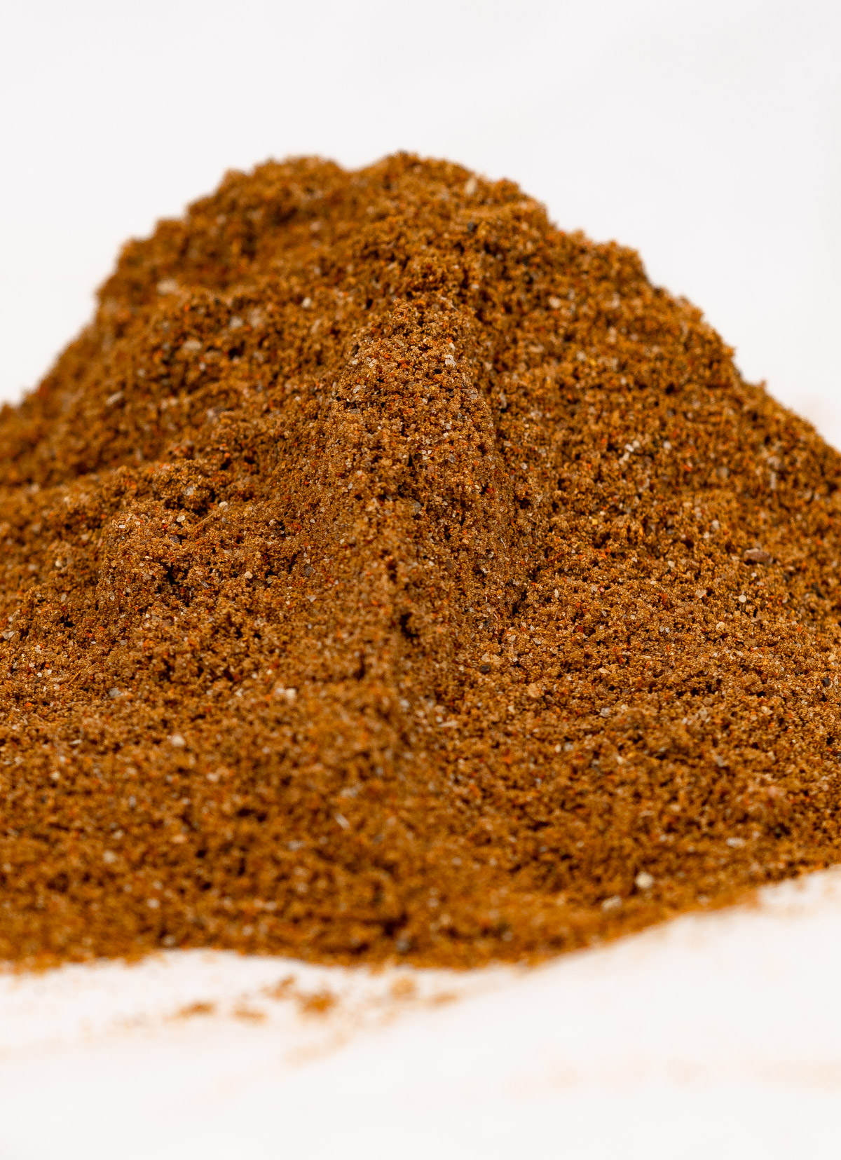 a mound of mixed brown spices