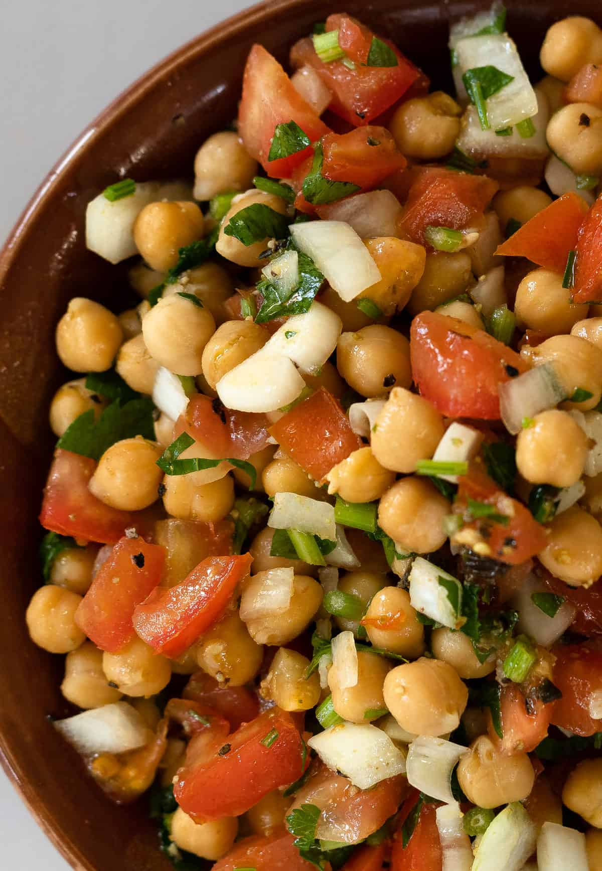 chickpeas salad in a brown bowl