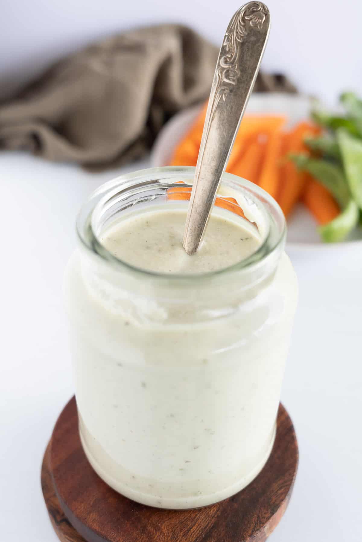 a jar filled with white dressing 