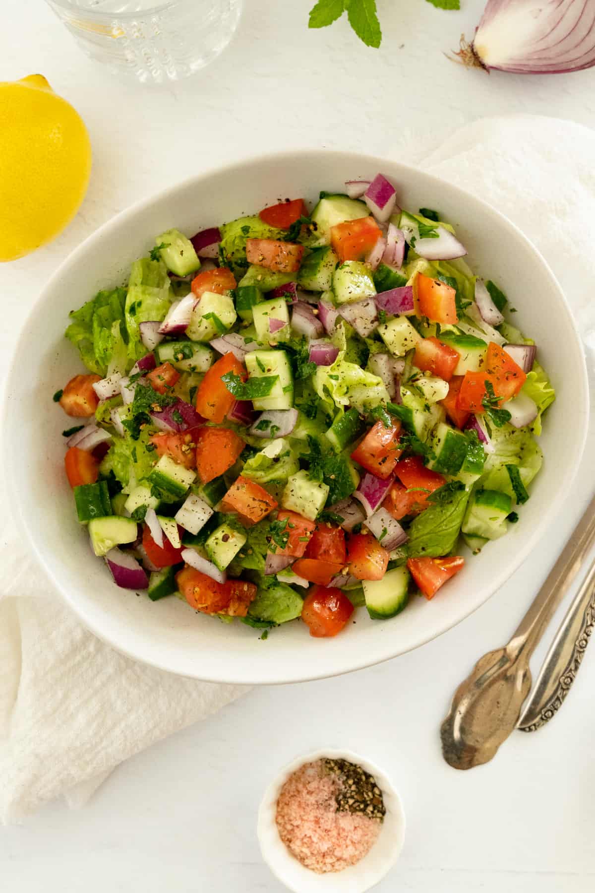 a white bowl with chopped vegetable salad