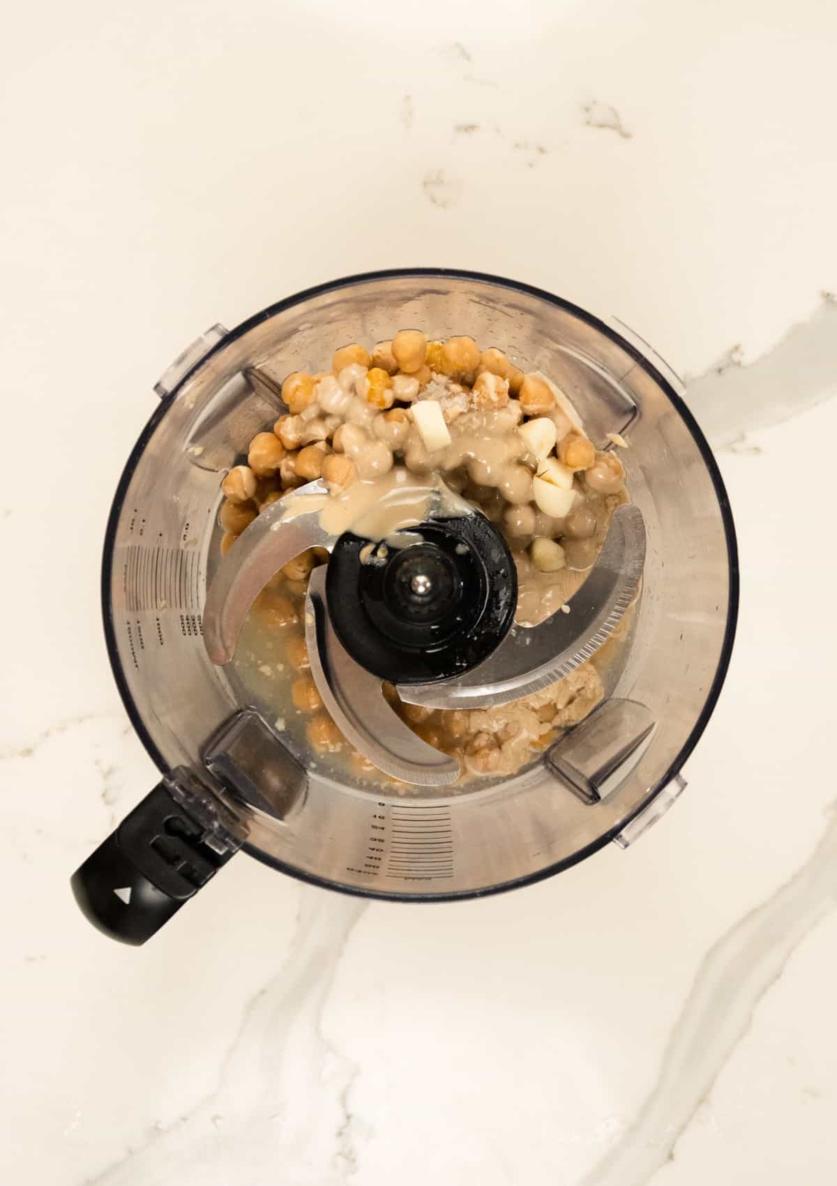 chickpeas, lemon juice, salt, garlic in a food processor jug