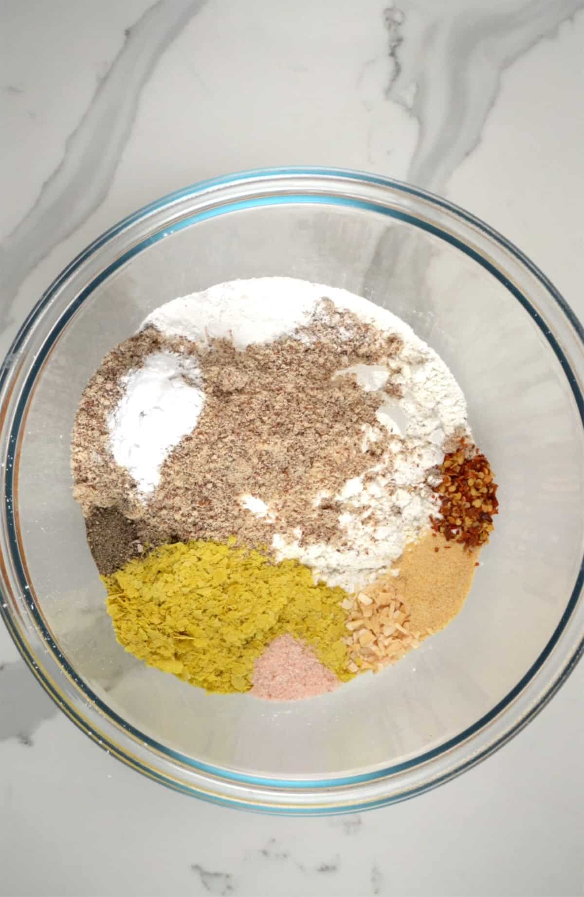 different flours and seasoning in a glass bowl