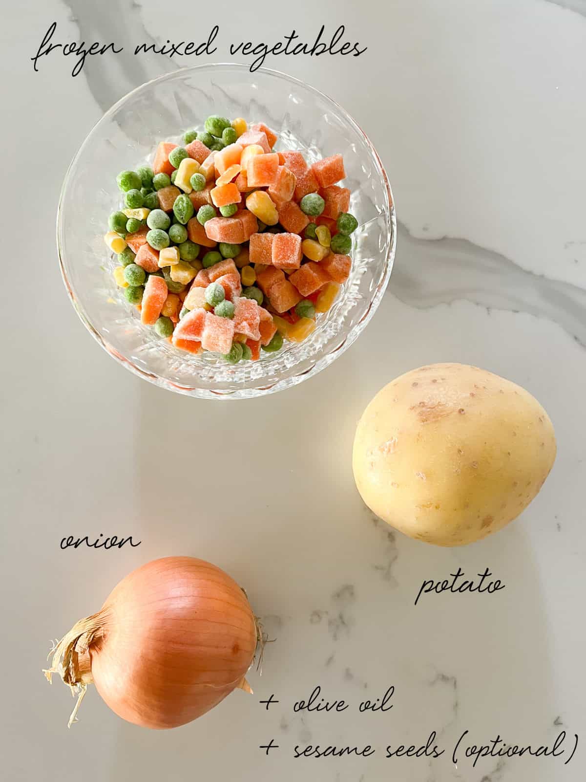 a bowl of frozen diced carrots, peas and corn and a potato and onion