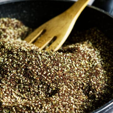 zaatar in a pan with a wooden spoon