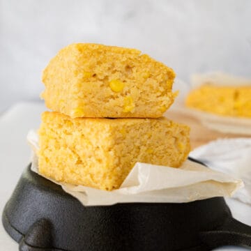 two yellow cornbread slices stacked on top of each other