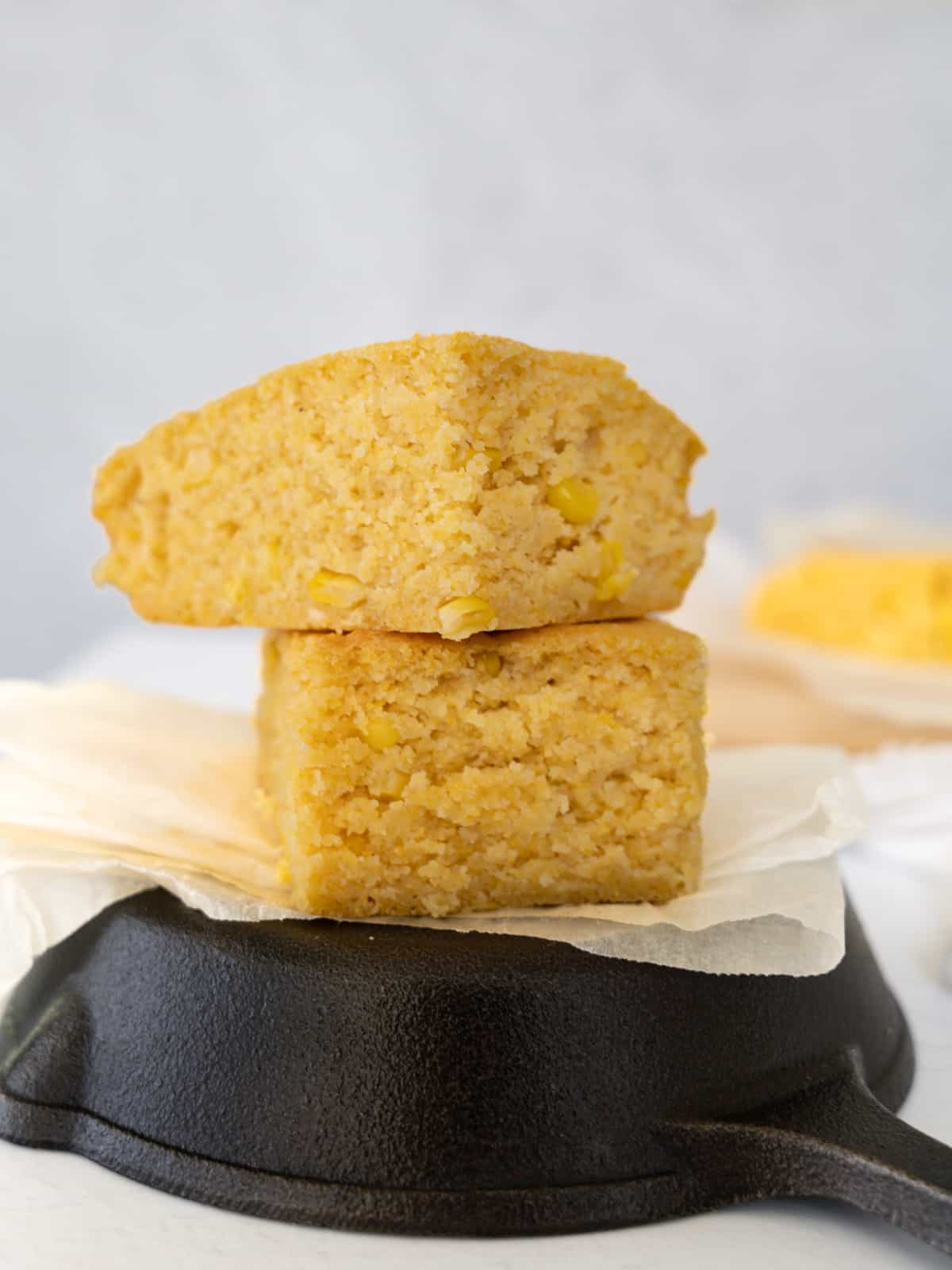 two staggered yellow cornbread slices stacked on top of each other