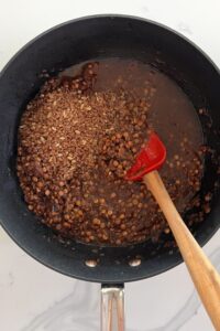 cracked bulgur added to the lentils and reddened onions