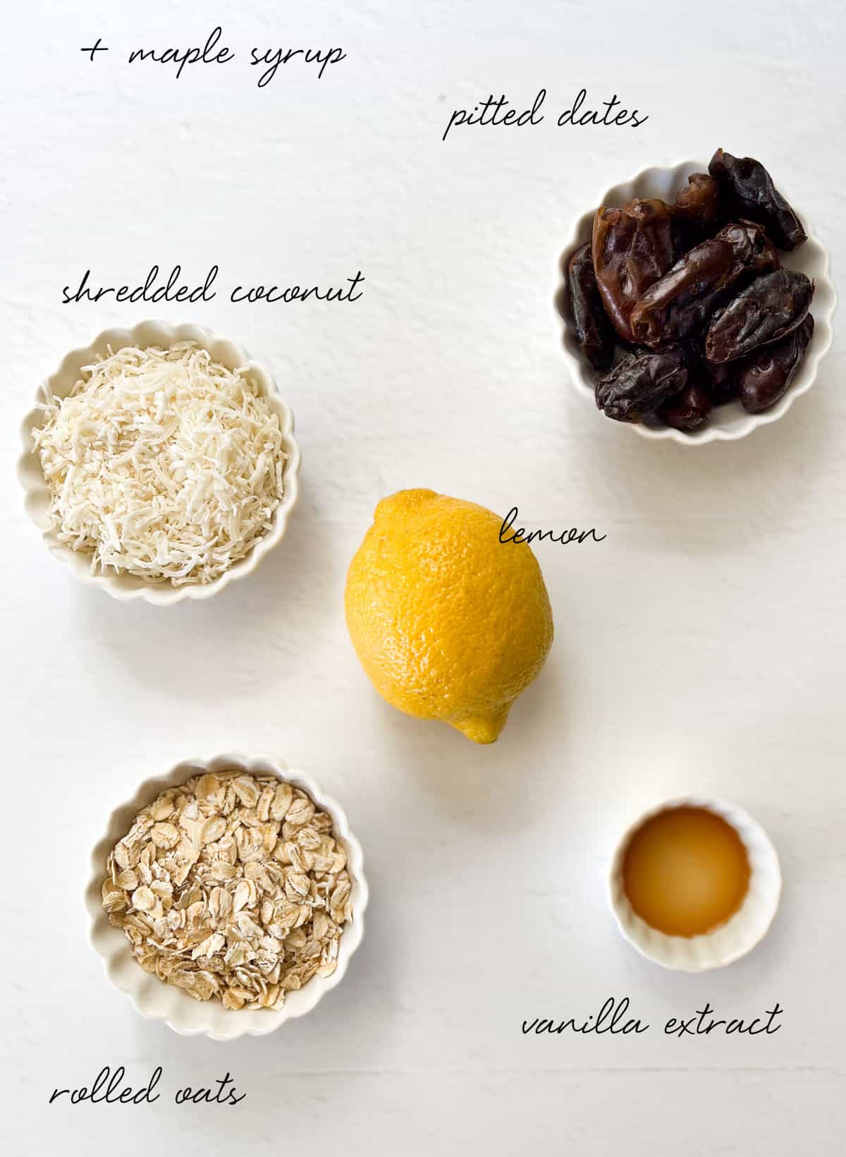 dates, lemon, shredded coconut, rolled oats and vanilla in bowls