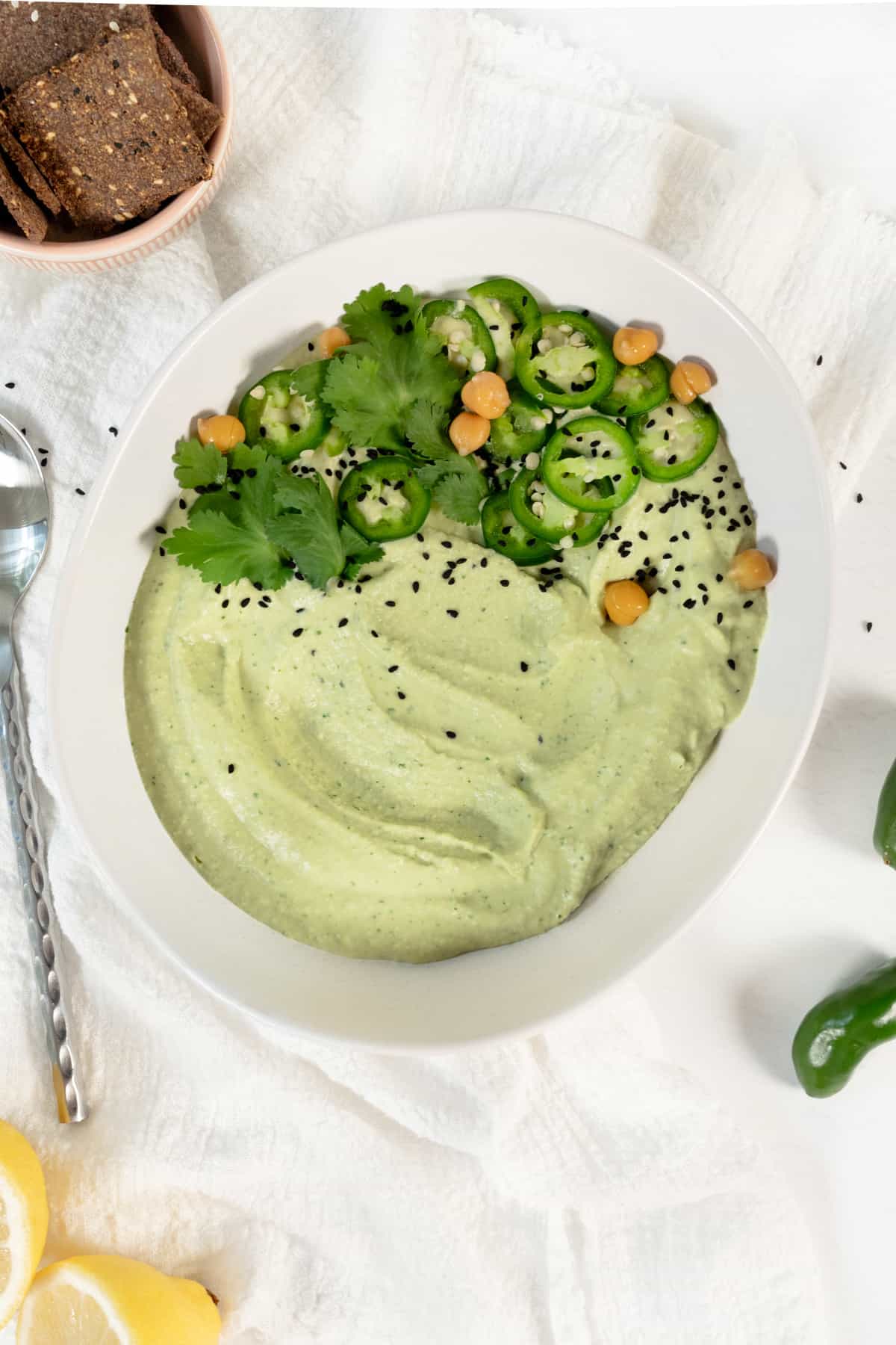 a bowl of jalapeno cilantro hummus