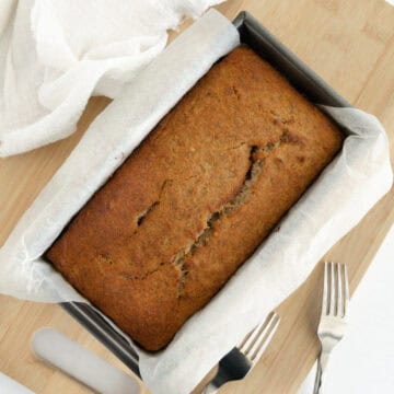 a loaf tin with a vegan gluten free banana bread in it
