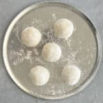 5 manakish dough balls on a tray